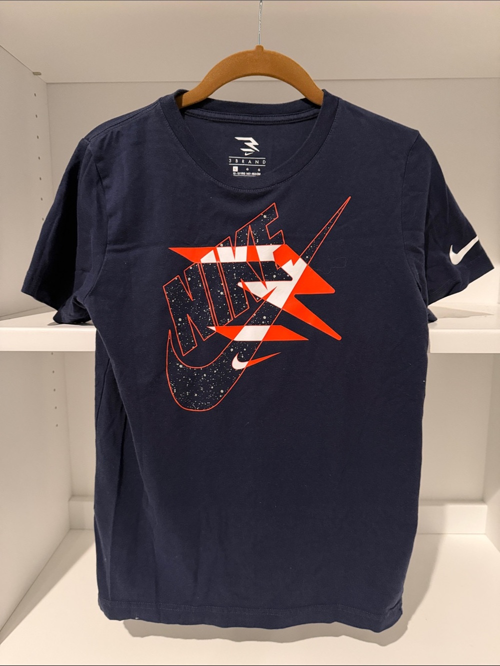 Nike Boys Navy Short Sleeve Graphic Tee with Orange and White Logo.  NWOT